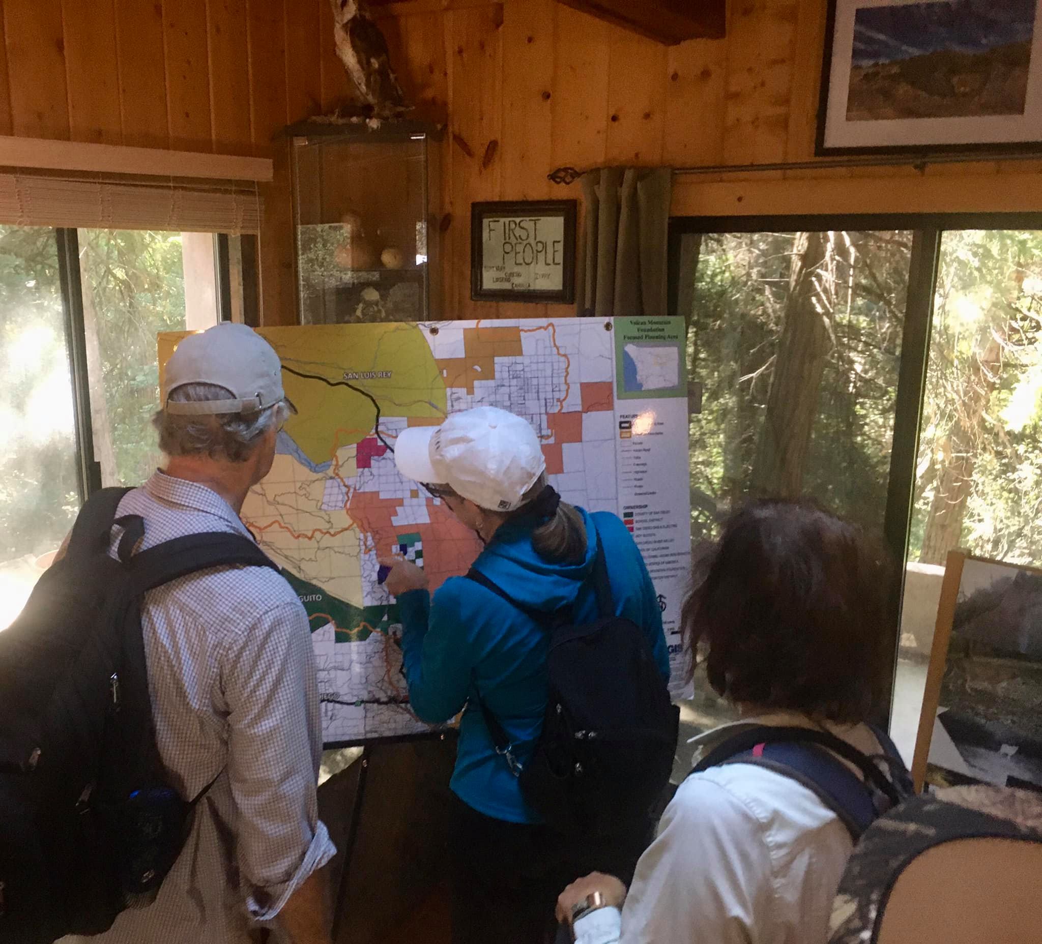 looking at a map inside the Volcan Mountain Foundation photo