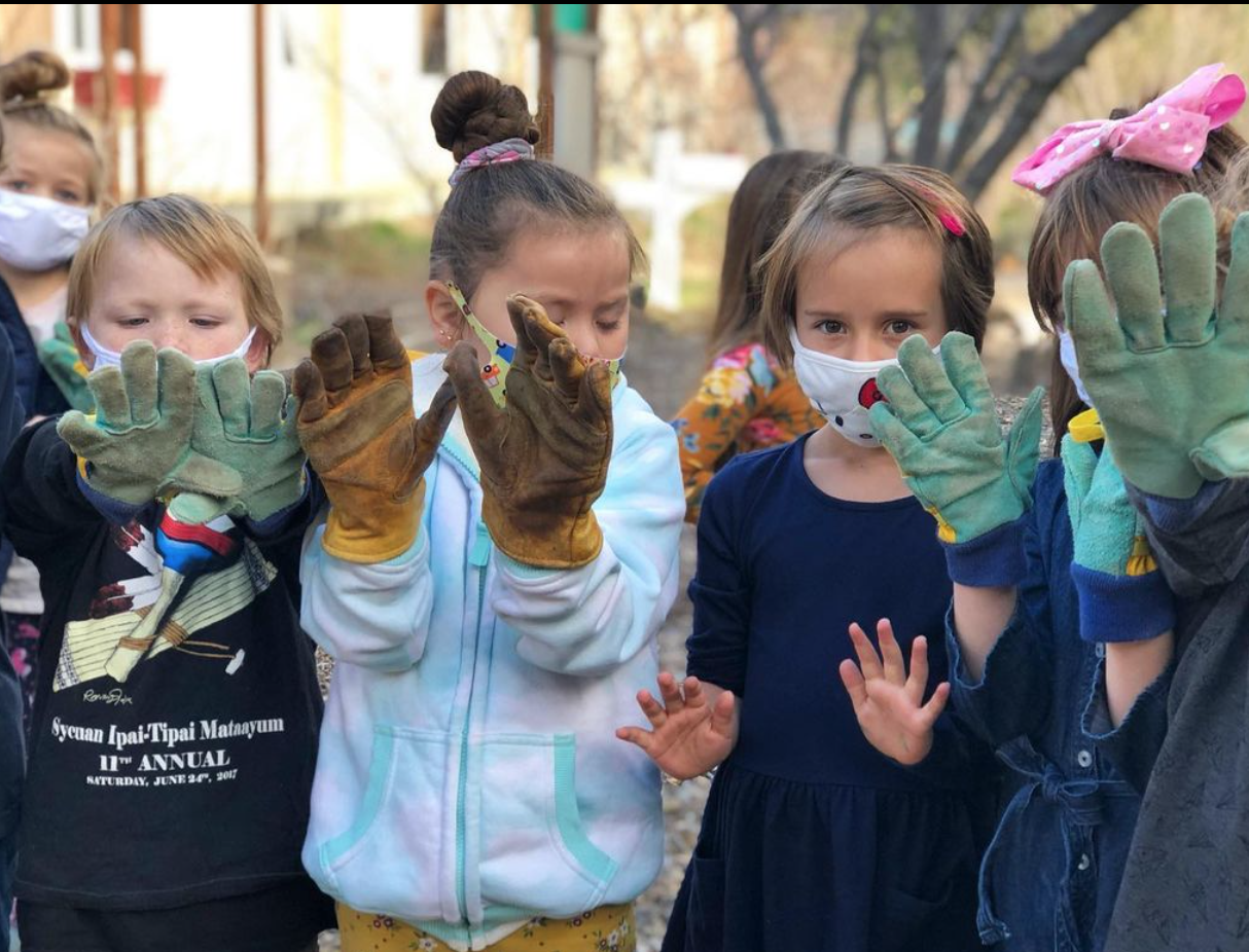Girls with their planting gloves on photo