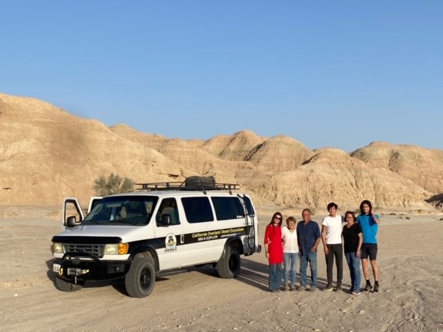California Overland Desert Excursions people standing by a van