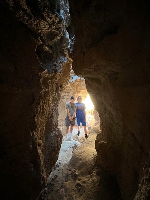 California Overland Desert Excursions two guys looking inside cave