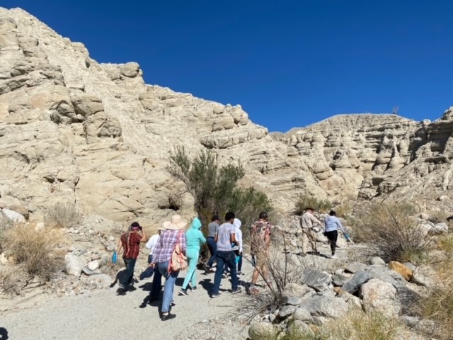 California Overland Desert Excursions people walking to rocks photo