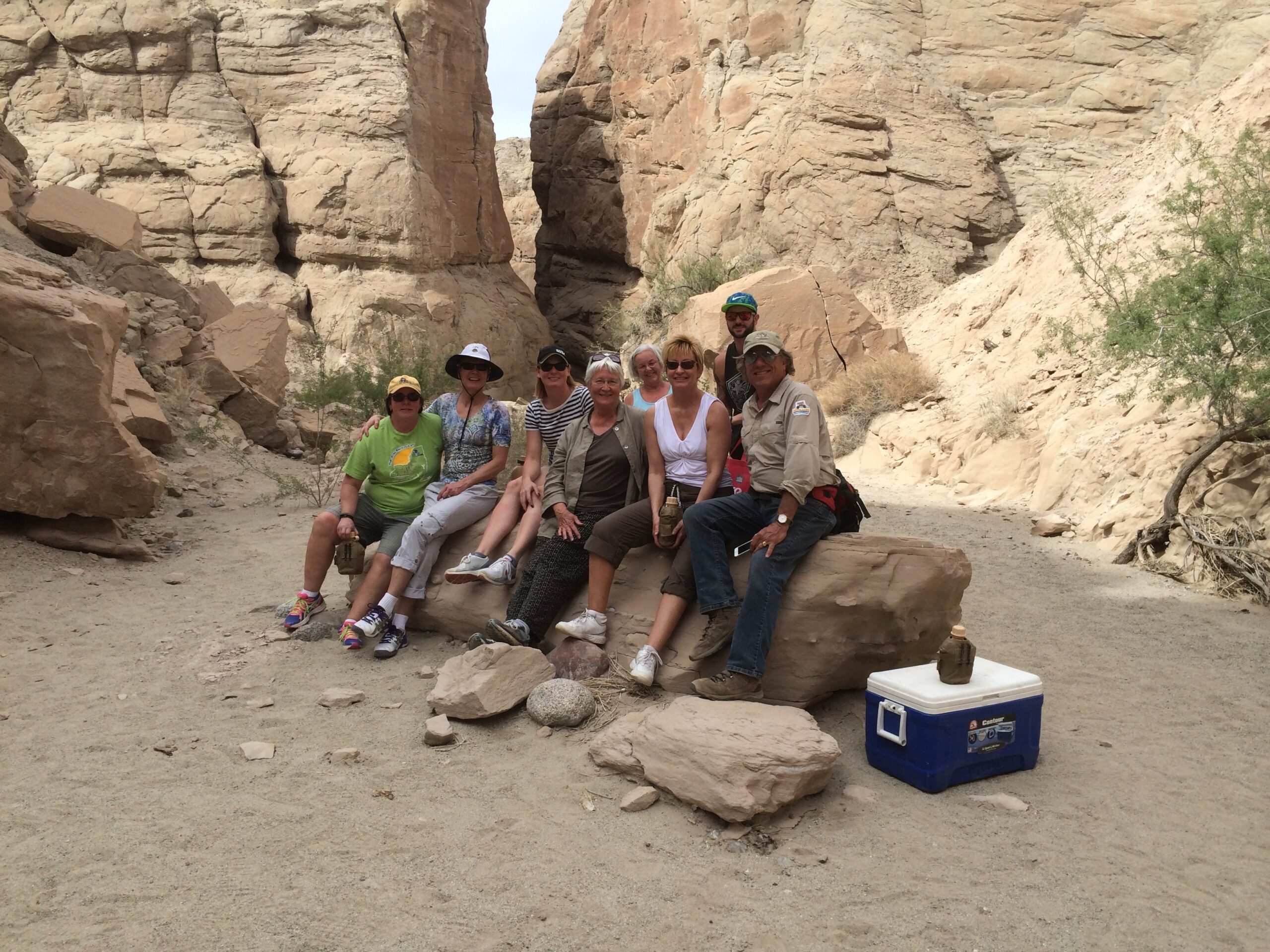 California Overland Desert Excursions people sitting on a rock photo